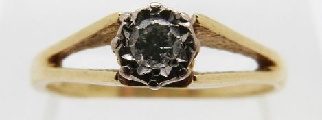 An 18ct gold ring set with a diamond in an illusion setting of approximately 0.15ct, size O, 2.