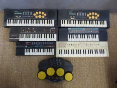 A collection of various Casio electronic keyboards to include Casiotone MT520, MT60 etc.