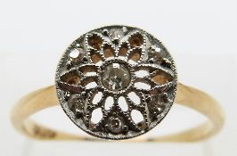 An 18ct gold ring set with diamonds in a pierced platinum mount, size P, 2.