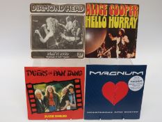 Approximately 100 rock singles including picture discs etc.