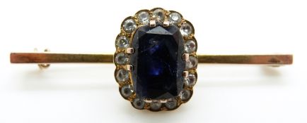 A 9ct gold brooch set with blue sapphire of approximately 4ct surrounded by white sapphires