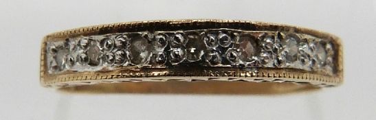 A 9ct gold half eternity ring set with round cut diamonds, size M, 1.