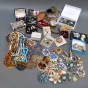 A collection of jewellery including beads, marcasite brooches, Hollywood brooch, bangles,