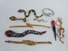 A Butler & Wilson snake brooch,