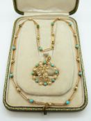 An Edwardian rose gold necklace made up of elongated links set with alternating seed pearls and