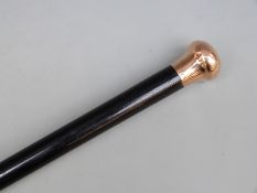 A 9ct gold mounted cane to Superintendent J Rees 1931