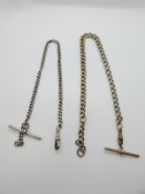 A hallmarked silver Albert and a graduated plated example