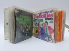 A large quantity of singles and a wallet style case