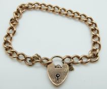 A 9ct rose gold curb link bracelet with heart padlock, 9.