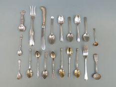 A collection of hallmarked silver and white metal spoons including a Dutch fork,