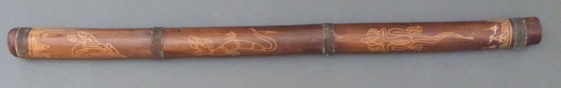 Aboriginal didgeridoo decorated with lizards,