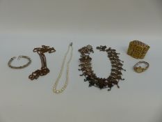 A silver/white metal filigree necklace, cultured pearl necklace,