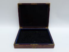 A tooled leather jewellery box