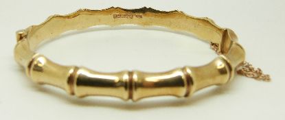 A 9ct gold bangle in bamboo design, 11.