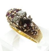 An 18ct gold bespoke ring set with diamonds, each approximately 0.15ct, and rubies, size N, 8.