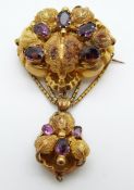 An early Etruscan Revival Victorian yellow metal brooch, with chased and embossed decoration,