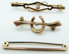 Three 9ct gold brooches, one in the form of a horseshoe, 3.