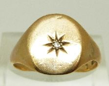 A 9ct gold signet ring set with a diamond in a star setting, size R, 3.