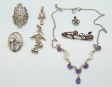 A collection of silver including pendants,