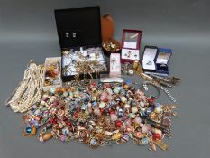 A collection of costume jewellery including beads, necklaces, earrings, cufflinks,