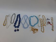 A collection of necklaces including Art Deco crystal examples,