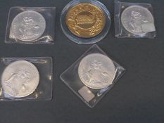 Four uncased Bahamas 1972 five dollar coins together with an English Sadler's Wells medallion