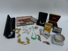 A collection of jewellery including glass beaded necklace, three silver bangles,