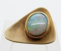 A 9ct gold ring set with an Australian opal cabochon in a triangular setting, size N/O, 6.