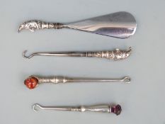 Edward VII hallmarked novelty silver-handled shoe horn and button hook, each with a Mr Punch handle,