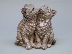 A hallmarked silver model of two cats,