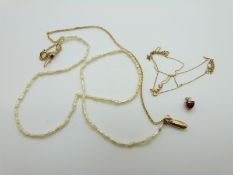A 9ct gold pendant set with a garnet and diamond and a pearl and 9ct gold necklace