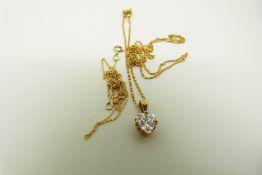 Two 14k gold chains and a 14k gold pendant set with a heart cut cubic zirconia, 2.