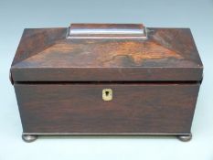 A 19thC rosewood tea two division tea caddy with hinged interior compartments and space for a