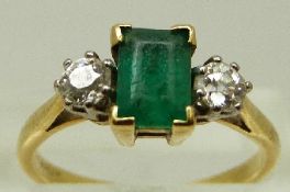An 18ct gold ring set with rectangular cut emerald of approximately 0.