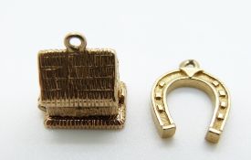 A 9ct gold horseshoe pendant/ charm and a 9ct gold charm in the form of a haystack opening to