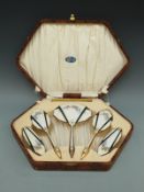 A cased dressing table set with guilloché enamel decoration and Goldsmiths,