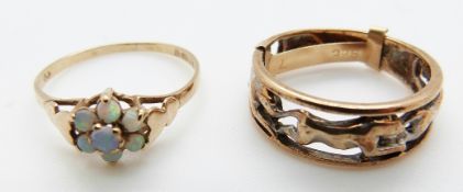 A 9ct gold ring depicting three leopards and a 9ct gold ring set with opals in a cluster, size K/L,