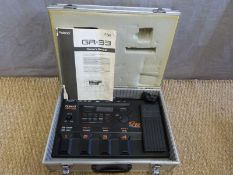 Roland GR-33 guitar synthesizer in aluminum carry case and owner's manual