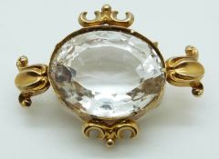 A large oval cut quartz in a yellow metal Victorian mount