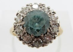An 18ct gold ring set with a zircon surrounded by diamonds, each approximately 0.