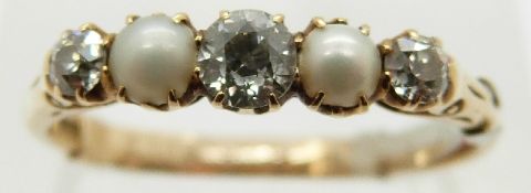 An 18ct gold Victorian ring set with three diamonds, the largest approximately 0.