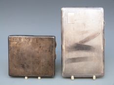 Two hallmarked silver cigarette cases with engine turned decoration and vacant cartouches,