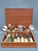 A collection of silver plated cutlery, silver topped dressing table pot,