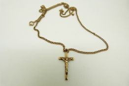 A 9ct gold chain and a 9ct gold crucifix, 7.