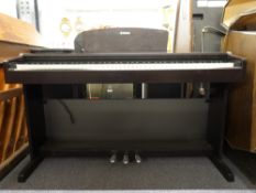 Yamaha YDP-131 digital piano.