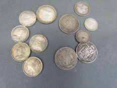 A group of Queen Victoria Jubilee coins comprising one 1889 shilling and four Jubilee sixpences,