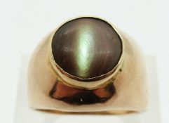 A 9ct gold ring set with an abalone cabochon, size S/T, 9.
