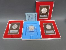 Four cased sterling silver proof coins including Peace Enduring,