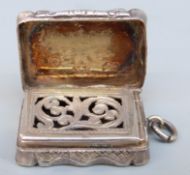 Victorian hallmarked silver vinaigrette with engraved decoration and gilt and pierced interior,