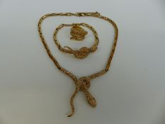 A suite of jewellery in the form of snakes set with paste, comprising bracelet,